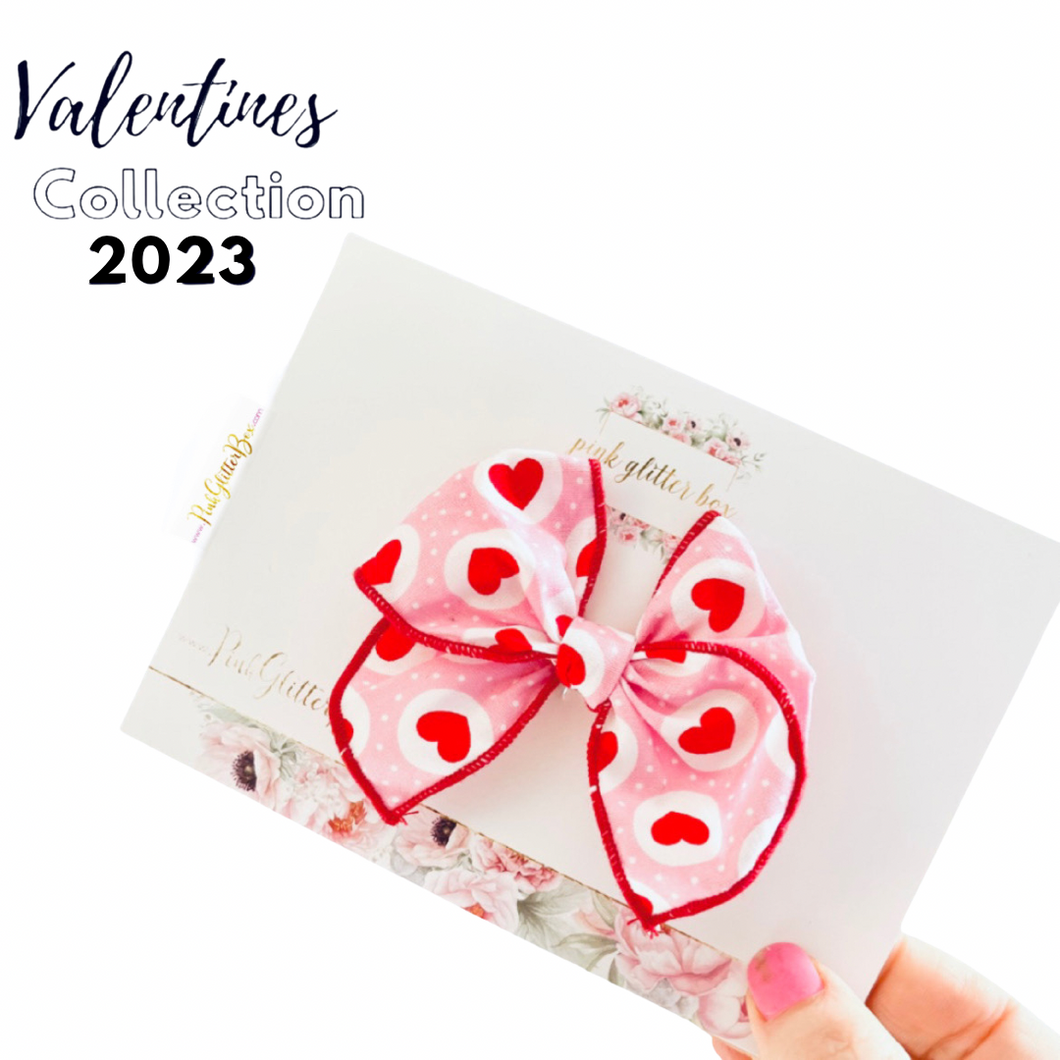 Valentine’s poppy bow- red hearts